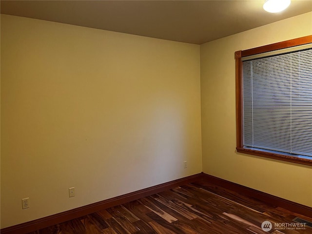 121 4th St, Langley, WA 98260 - empty room with baseboards and dark wood-style floors