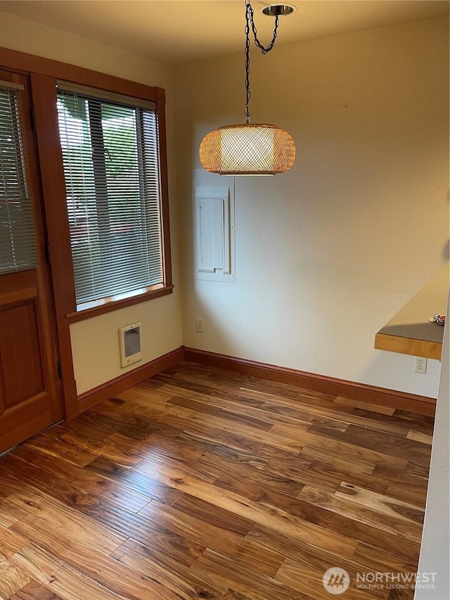 121 4th St, Langley, WA 98260 - unfurnished dining area with wood finished floors and baseboards