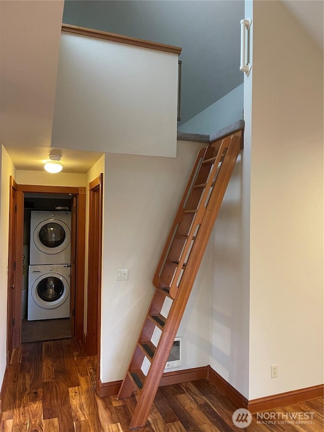 121 4th St, Langley, WA 98260 - staircase with stacked washer and clothes dryer and wood finished floors