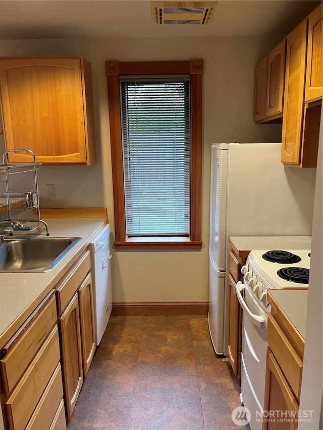 121 4th St, Langley, WA 98260 - kitchen featuring white appliances, light countertops, and dark floors