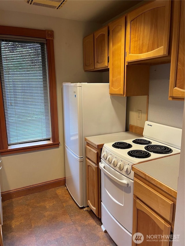 121 4th St, Langley, WA 98260 - kitchen featuring white range with electric stovetop and light countertops