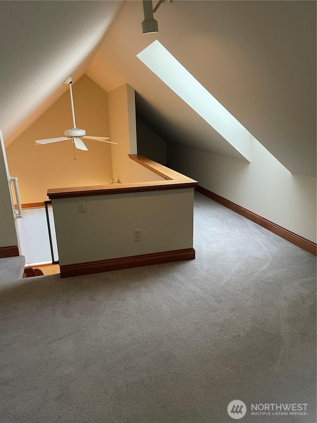 121 4th St, Langley, WA 98260 - bonus room featuring carpet, lofted ceiling, a skylight, and ceiling fan