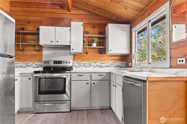 19834 State Route 20, Twisp, WA 98856 - kitchen featuring stainless steel appliances, vaulted ceiling, open shelves, light countertops, and wood ceiling