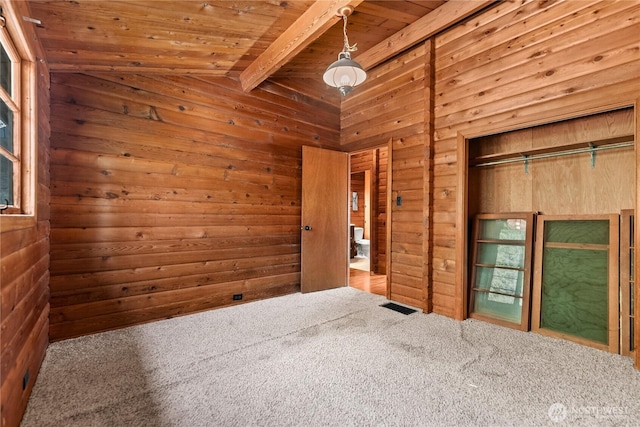 19834 State Route 20, Twisp, WA 98856 - carpeted spare room featuring a wooden ceiling with exposed beams and wooden walls