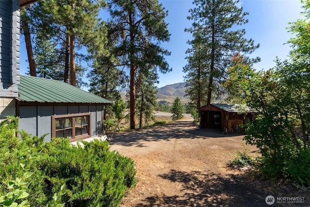 19834 State Route 20, Twisp, WA 98856 - view of yard with a mountain view and an outbuilding