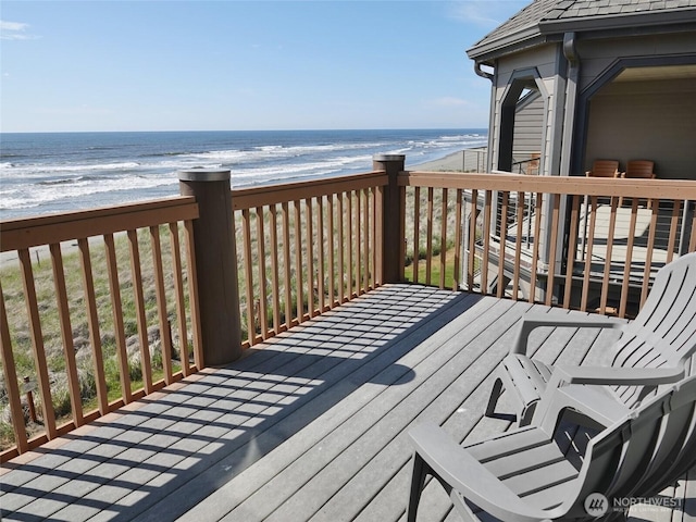 1407 Ocean Shores Blvd SW Unit 3N-H, Ocean Shores, WA 98569 - wooden terrace with view of water and beach and a garage