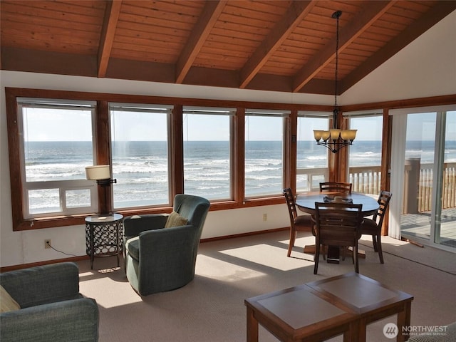 1407 Ocean Shores Blvd SW Unit 3N-H, Ocean Shores, WA 98569 - sunroom featuring carpet floors, view of water and beach, a chandelier, and wood ceiling