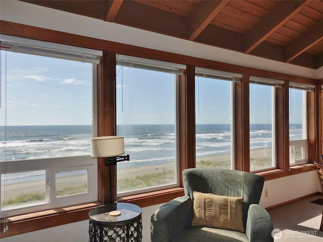 1407 Ocean Shores Blvd SW Unit 3N-H, Ocean Shores, WA 98569 - sunroom / solarium with view of water and beach, plenty of natural light, and a wood ceiling with exposed beams