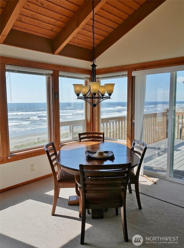 1407 Ocean Shores Blvd SW Unit 3N-H, Ocean Shores, WA 98569 - carpeted dining room with a chandelier, a water view, and wooden ceiling