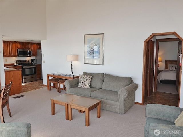 1407 Ocean Shores Blvd SW Unit 3N-H, Ocean Shores, WA 98569 - living area with light colored carpet and arched walkways