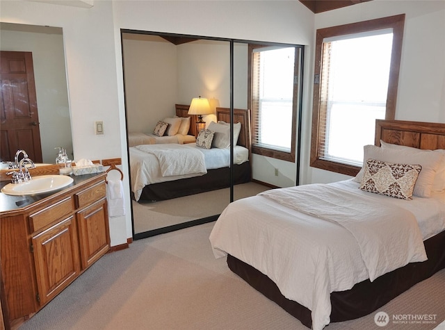 1407 Ocean Shores Blvd SW Unit 3N-H, Ocean Shores, WA 98569 - bedroom featuring a closet and light colored carpet