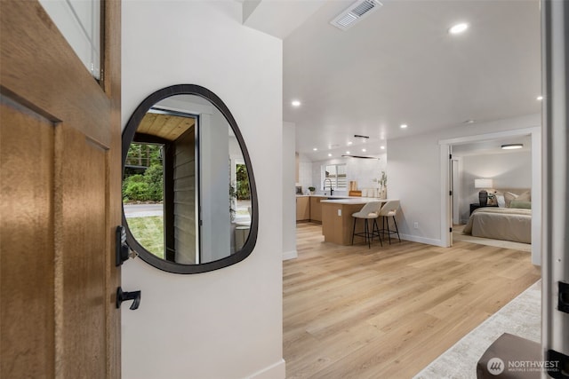 840 NE 100th St Unit A, Seattle, WA 98125 - foyer featuring light wood-style floors, recessed lighting, and arched walkways