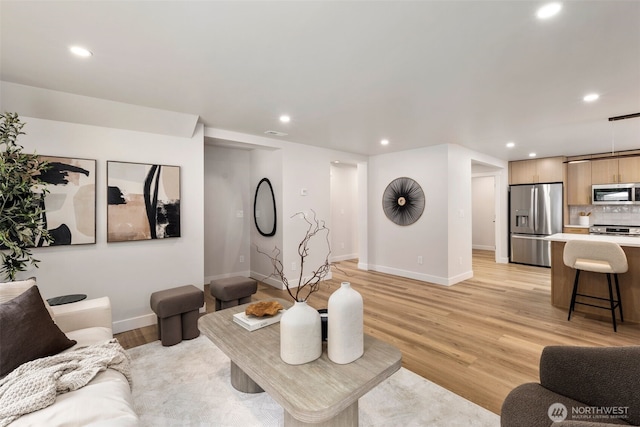 840 NE 100th St Unit A, Seattle, WA 98125 - living room featuring recessed lighting and light wood-type flooring