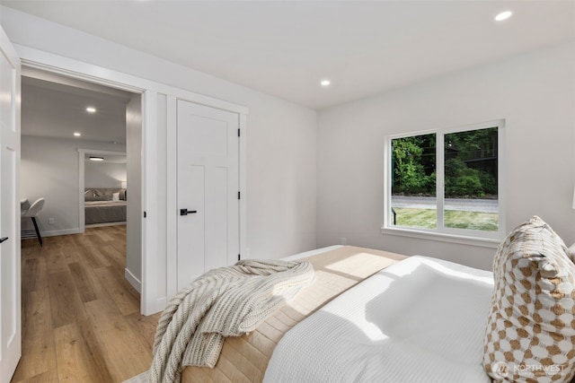840 NE 100th St Unit A, Seattle, WA 98125 - bedroom with light wood-type flooring, recessed lighting, and a closet