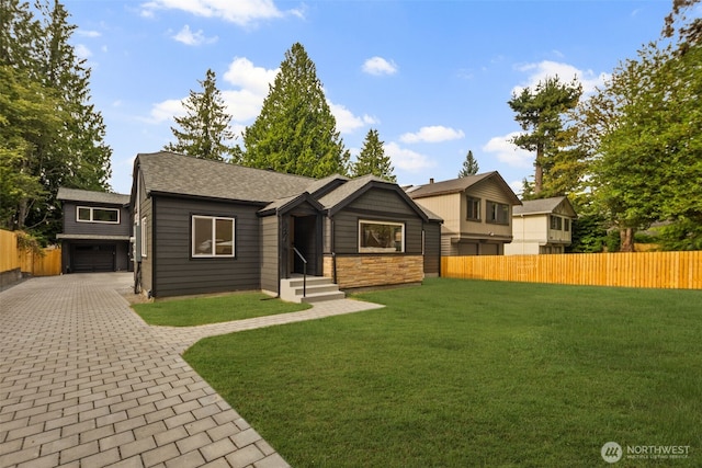 840 NE 100th St Unit A, Seattle, WA 98125 - view of front facade featuring driveway, stone siding, a garage, and a shingled roof