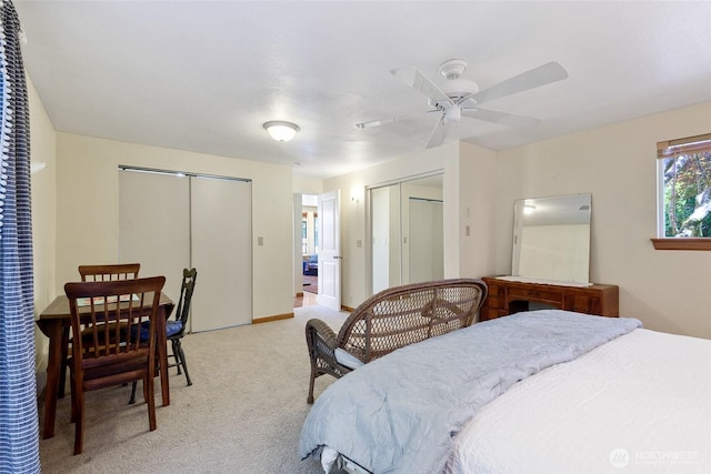 7717 176th Ave SW, Longbranch, WA 98351 - bedroom featuring multiple closets, light carpet, and ceiling fan