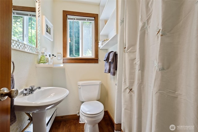 7717 176th Ave SW, Longbranch, WA 98351 - full bathroom featuring plenty of natural light, wood finished floors, and curtained shower