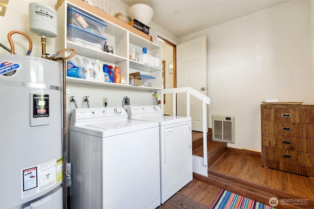 7717 176th Ave SW, Longbranch, WA 98351 - laundry area with secured water heater, wood finished floors, separate washer and dryer, and heating unit