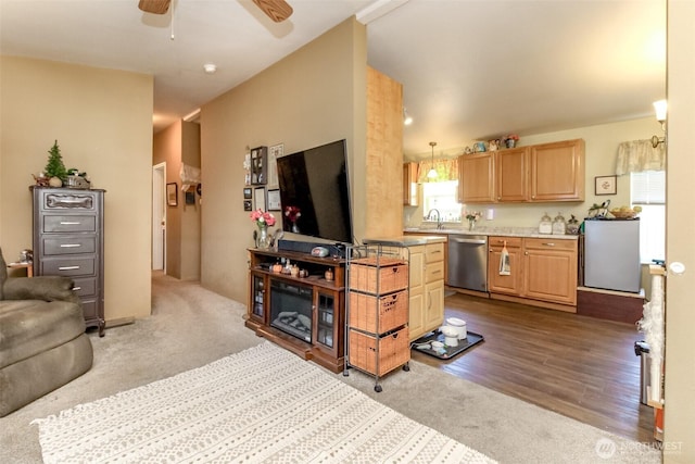 2101 S 324th St Unit 22, Federal Way, WA 98003 - carpeted living area featuring a ceiling fan and wood finished floors