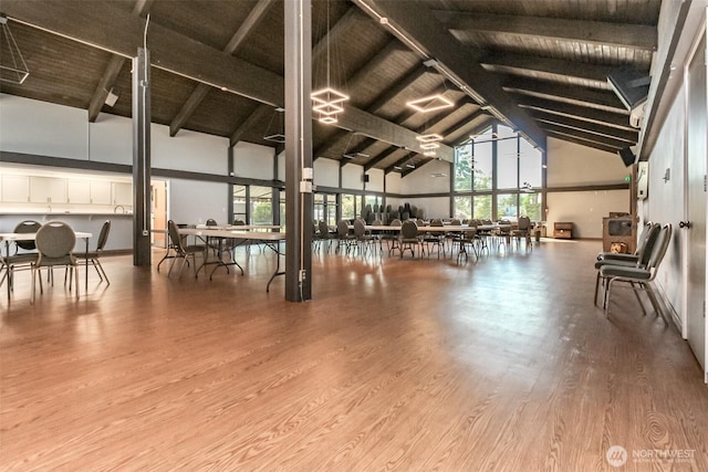 2101 S 324th St Unit 22, Federal Way, WA 98003 - misc room with high vaulted ceiling, wood finished floors, and a wooden ceiling with exposed beams