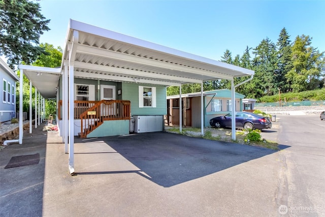 2101 S 324th St Unit 22, Federal Way, WA 98003 - view of parking with a carport and stairs