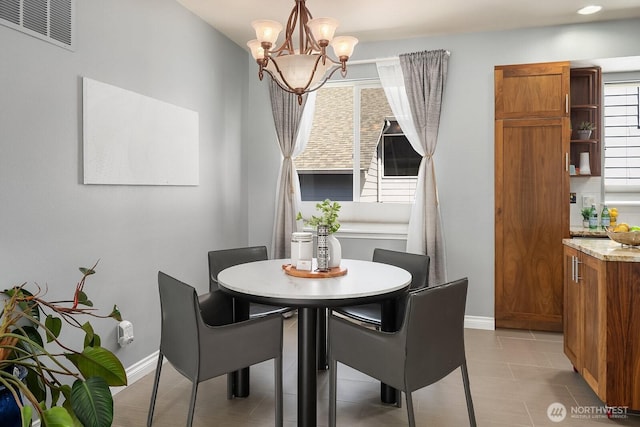 10113 SE 220th Pl, Kent, WA 98031 - dining space with a chandelier and light tile patterned floors
