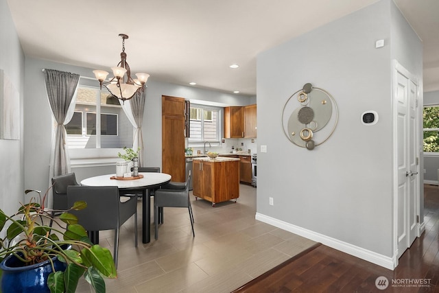 10113 SE 220th Pl, Kent, WA 98031 - dining room with a chandelier, wood finished floors, and recessed lighting