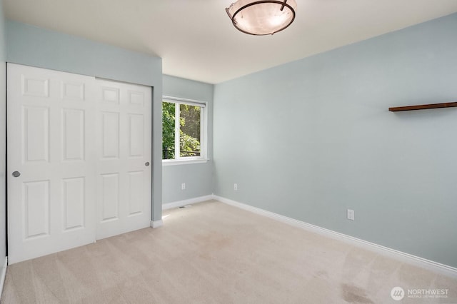 10113 SE 220th Pl, Kent, WA 98031 - unfurnished bedroom with light colored carpet and a closet