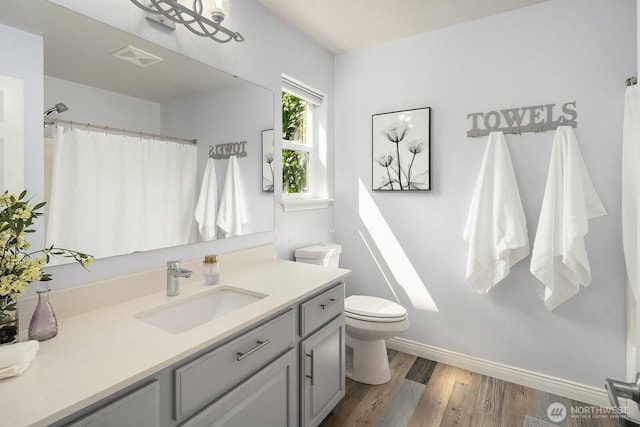 10113 SE 220th Pl, Kent, WA 98031 - full bathroom featuring vanity, wood finished floors, and a shower with shower curtain