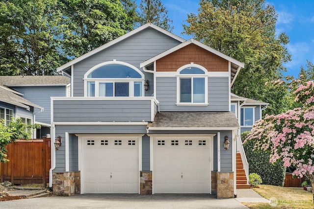 10113 SE 220th Pl, Kent, WA 98031 - view of front of property featuring stone siding, a garage, driveway, and stairway