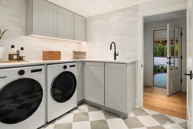 2610 86th Ave NE, Clyde Hill, WA 98004 - washroom featuring washing machine and clothes dryer, cabinet space, recessed lighting, and light flooring
