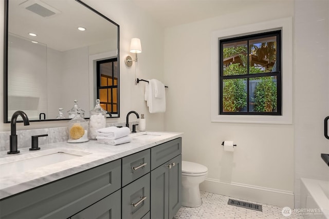 2610 86th Ave NE, Clyde Hill, WA 98004 - full bath featuring double vanity, recessed lighting, speckled floor, and shower / bath combination