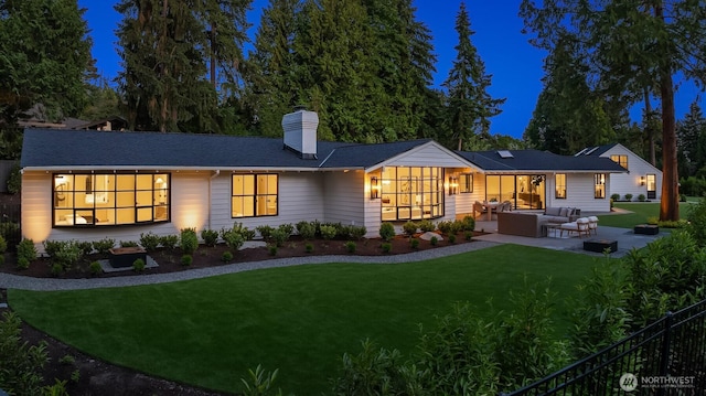 2610 86th Ave NE, Clyde Hill, WA 98004 - rear view of property with outdoor lounge area, a patio, and a chimney