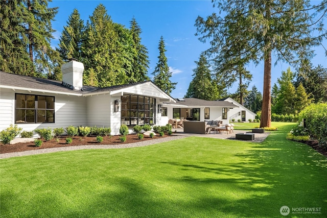 2610 86th Ave NE, Clyde Hill, WA 98004 - back of property featuring outdoor lounge area, a lawn, a sunroom, a chimney, and a patio area