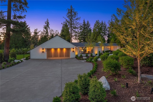 2610 86th Ave NE, Clyde Hill, WA 98004 - view of front facade featuring a garage and concrete driveway