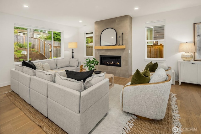 3052 SE 13th Pl, North Bend, WA 98045 - living room featuring wood finished floors, a tile fireplace, and recessed lighting