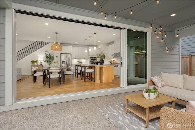 3052 SE 13th Pl, North Bend, WA 98045 - living area featuring dark speckled floor, recessed lighting, and stairway