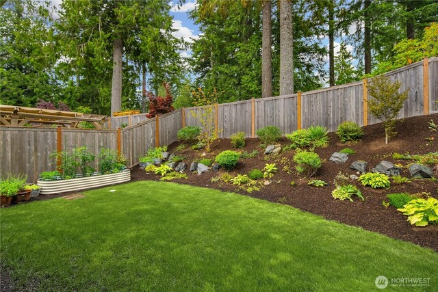 3052 SE 13th Pl, North Bend, WA 98045 - fenced backyard with a garden