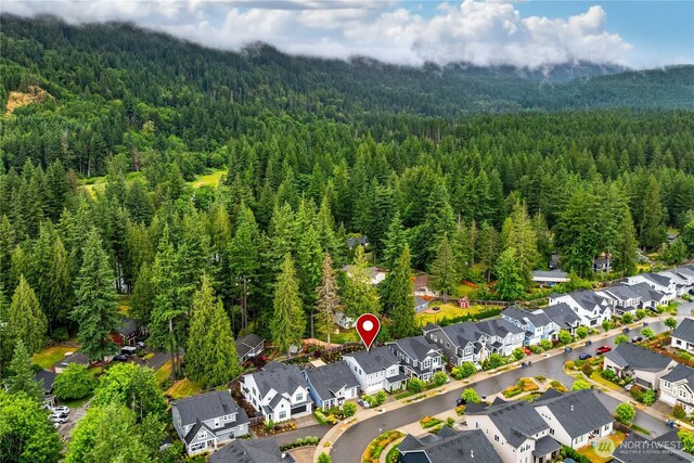 3052 SE 13th Pl, North Bend, WA 98045 - aerial perspective of suburban area featuring a heavily wooded area