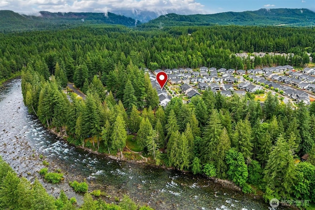 3052 SE 13th Pl, North Bend, WA 98045 - aerial overview of property's location featuring a forest and a mountainous background