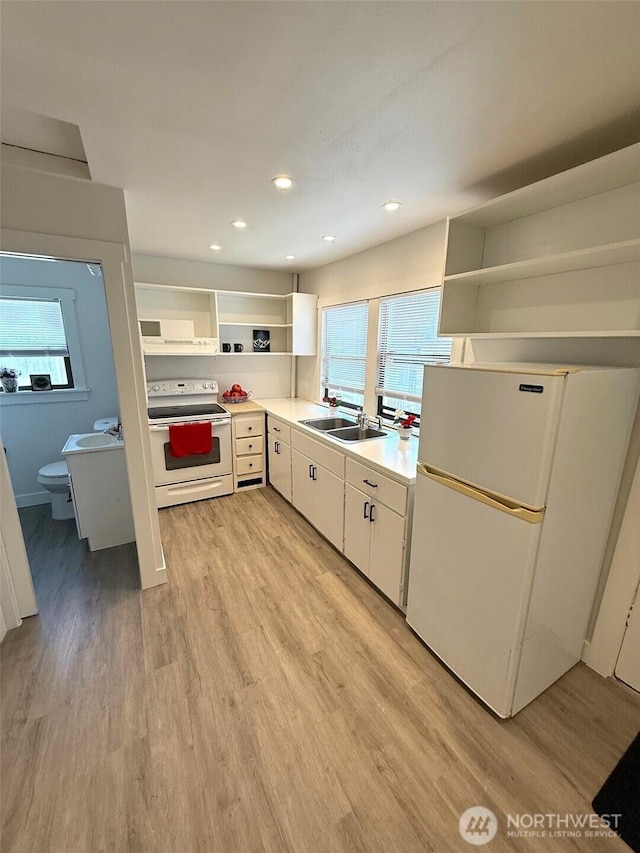 2521 Walnut St, Everett, WA 98201 - kitchen with white appliances, open shelves, plenty of natural light, light wood-style floors, and recessed lighting
