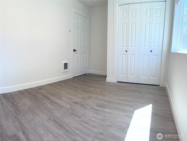 2521 Walnut St, Everett, WA 98201 - unfurnished bedroom with wood finished floors and a closet