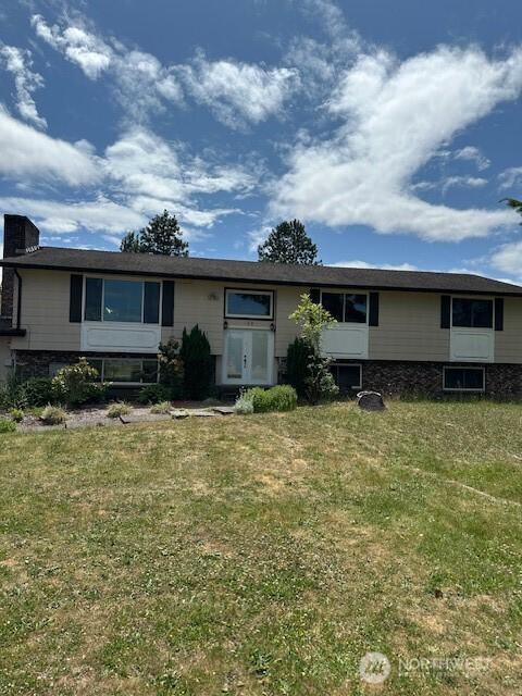 129 W Washington St, Napavine, WA 98565 - view of front of house with a front yard and a chimney