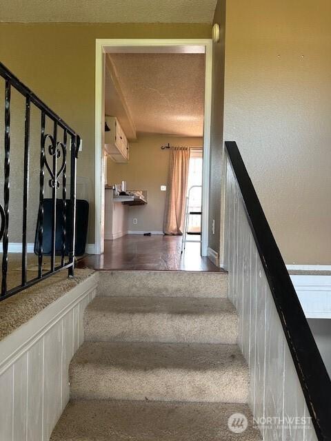 129 W Washington St, Napavine, WA 98565 - stairs featuring a textured ceiling and baseboards