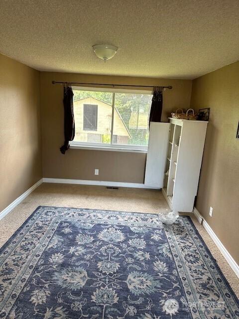 129 W Washington St, Napavine, WA 98565 - unfurnished room with a textured ceiling and light carpet
