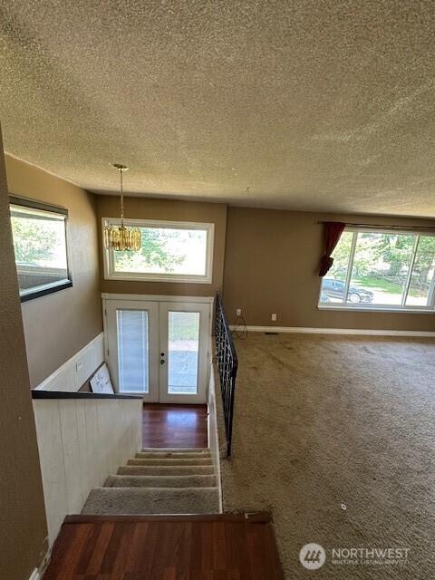 129 W Washington St, Napavine, WA 98565 - foyer entrance with a textured ceiling, a chandelier, and stairs