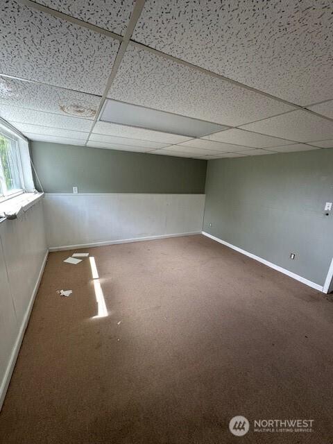 129 W Washington St, Napavine, WA 98565 - carpeted empty room with a drop ceiling and baseboards