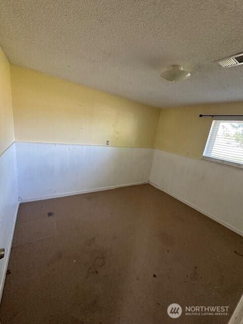 129 W Washington St, Napavine, WA 98565 - unfurnished room with carpet flooring and a textured ceiling