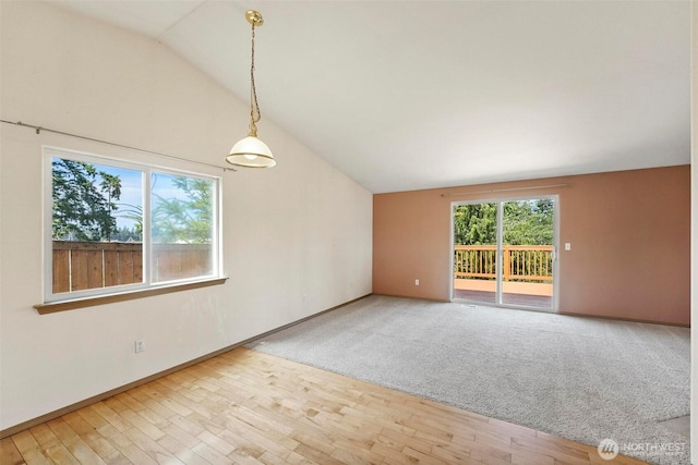 8506 8th Ct SE, Olympia, WA 98513 - empty room featuring vaulted ceiling and wood finished floors