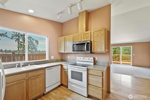 8506 8th Ct SE, Olympia, WA 98513 - kitchen with white appliances, rail lighting, light brown cabinetry, light wood finished floors, and light countertops